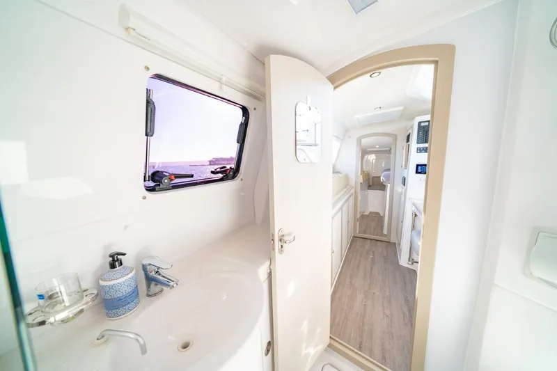 Sugarloaf Yacht Photos Pics Interior of 2023 Seawind 1160 Lite catamaran, featuring modern bathroom and hallway view.