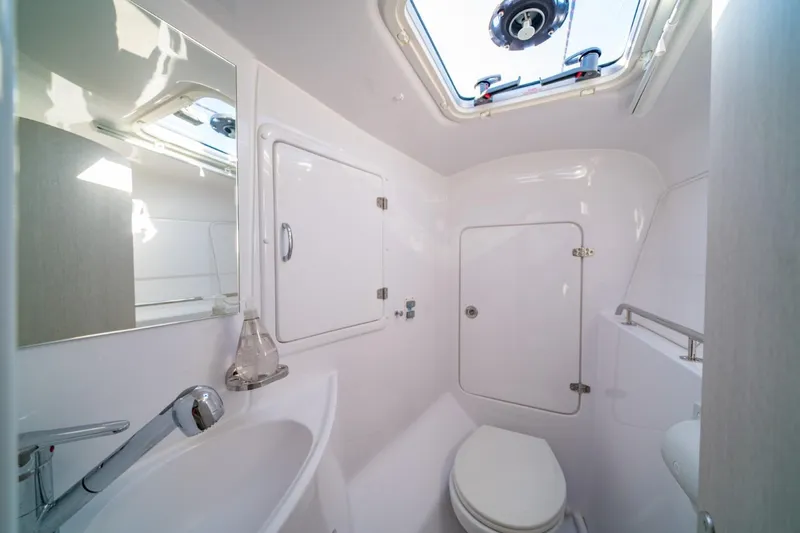 Sugarloaf Yacht Photos Pics 2023 Seawind 1160 Lite yacht bathroom with skylight, sink, and toilet.