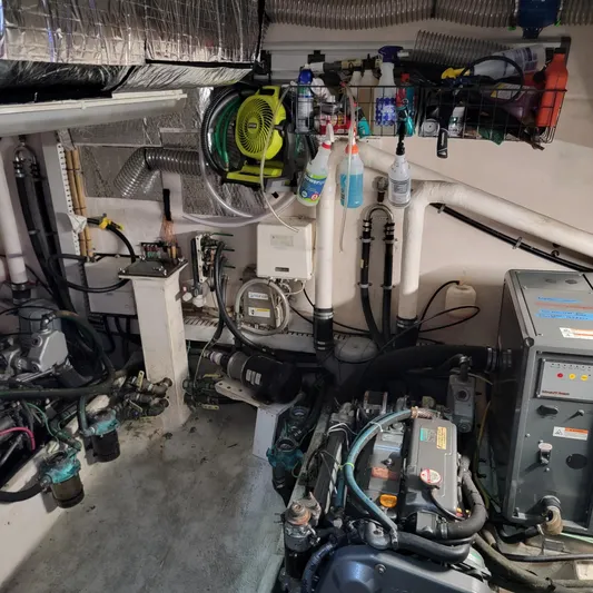 No Good Deed Yacht Photos Pics Engine room of a 2007 Great Harbour N47 yacht with various mechanical components.