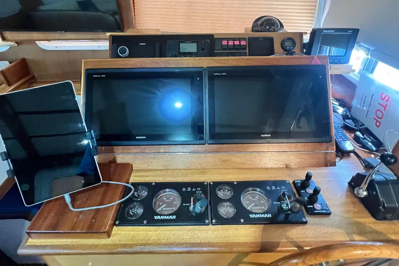 No Good Deed Yacht Photos Pics Control panel of a 2007 Great Harbour N47 boat with dual screens and Yanmar gauges.