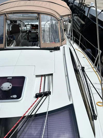  Yacht Photos Pics 2011 Jeanneau Sun Odyssey 45 DS sailboat with beige canopy and deck view.