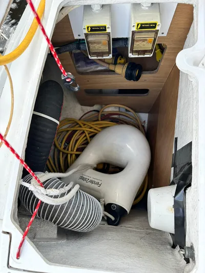  Yacht Photos Pics Storage compartment of 2011 Jeanneau Sun Odyssey 45 DS with hoses and cables.