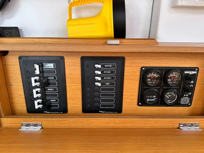  Yacht Photos Pics Control panel of 2011 Jeanneau Sun Odyssey 45 DS sailboat with switches and gauges.