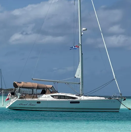  Yacht Photos Pics Sailboat Jeanneau Sun Odyssey 45 DS 2011 anchored in turquoise waters.