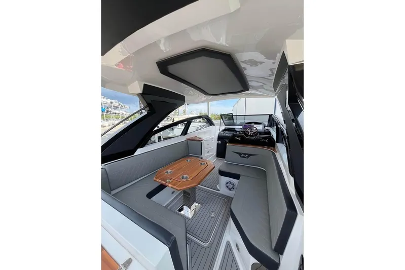  Yacht Photos Pics 2023 NX Boats 360 Sport Coupe interior with sleek seating and modern design.