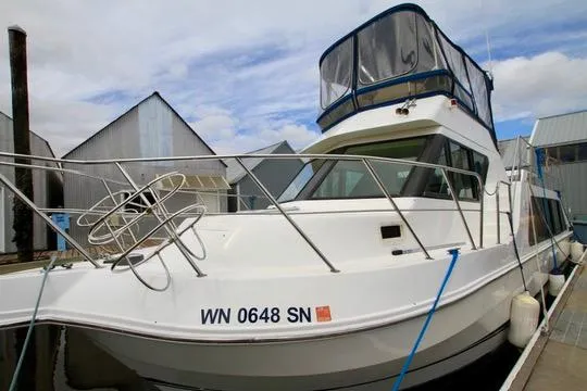 Smitten Yacht Photos Pics 2006 Harbor Master Coastal 400 boat docked at marina with blue skies.