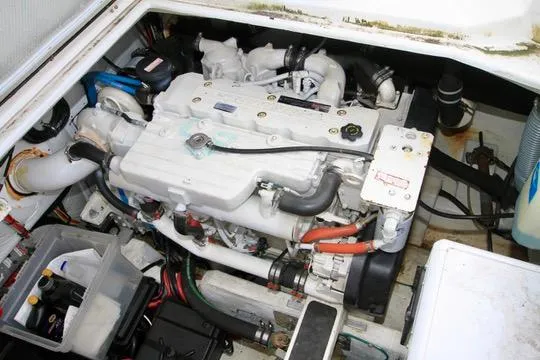 Smitten Yacht Photos Pics Engine compartment of a 2006 Harbor Master Coastal 400 boat, showcasing mechanical components.