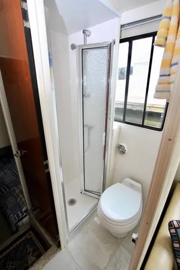 Smitten Yacht Photos Pics Compact bathroom in 2006 Harbor Master Coastal 400 boat with shower and toilet.