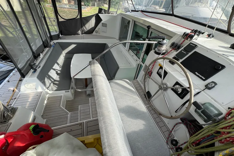 Willow Yacht Photos Pics 2008 Lagoon 420 yacht cockpit with steering wheel, seating, and navigation equipment.