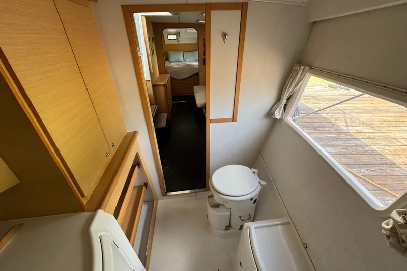 Willow Yacht Photos Pics Interior of 2008 Lagoon 420 yacht showing bathroom and cabin area.