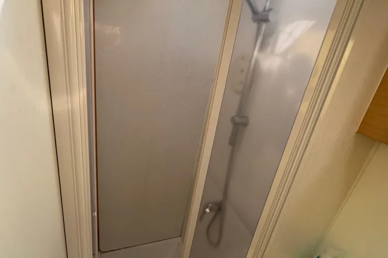 Willow Yacht Photos Pics Shower area inside a 2008 Lagoon 420 yacht, featuring a sleek design.