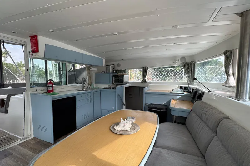 Willow Yacht Photos Pics Interior of 2008 Lagoon 420 catamaran with kitchen, dining area, and navigation station.