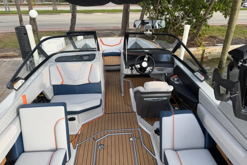 Coastal Edition Yacht Photos Pics 2022 Nautique Super Air Nautique G25 interior with modern seating and sleek dashboard design.