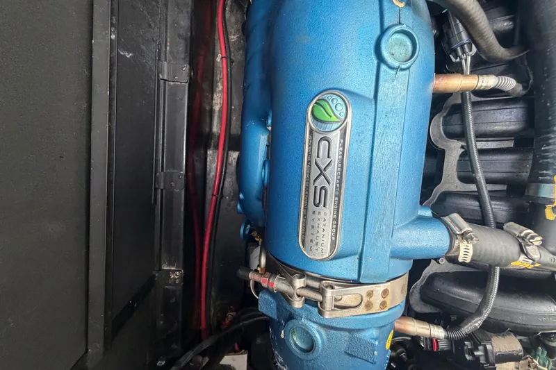 Coastal Edition Yacht Photos Pics 2022 Nautique Super Air Nautique G25 engine, featuring a blue CXS exhaust system.