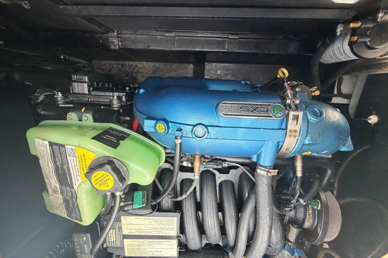 Coastal Edition Yacht Photos Pics Engine of 2022 Nautique Super Air Nautique G25 boat, featuring blue and green components.