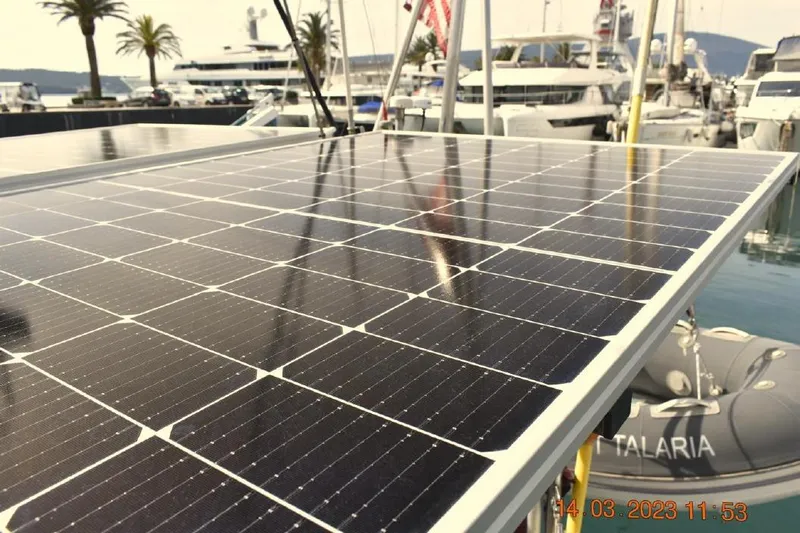 Talaria Yacht Photos Pics Solar panels on a 1988 Tayana Vancouver 42 yacht in a marina setting.