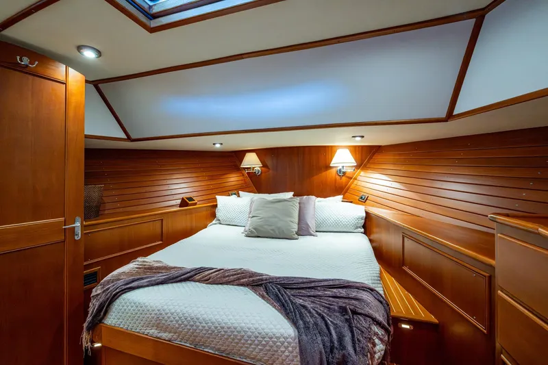 Bright Star Yacht Photos Pics Luxurious cabin interior of 2003 Grand Banks 49 Eastbay HX yacht with cozy bedding.