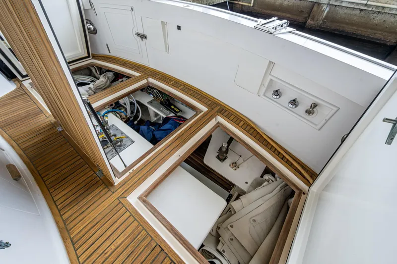 Bright Star Yacht Photos Pics 2003 Grand Banks 49 Eastbay HX yacht with open storage compartments on teak deck.