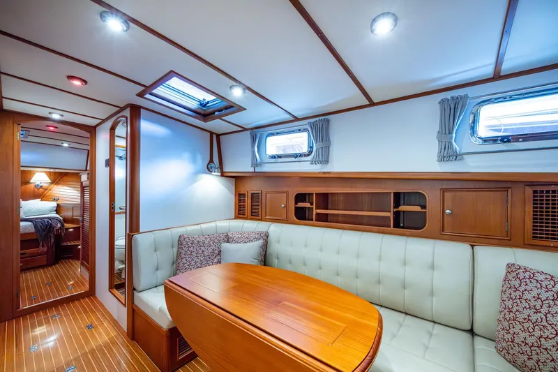 Bright Star Yacht Photos Pics Luxurious interior of 2003 Grand Banks 49 Eastbay HX yacht with elegant wood finishes.