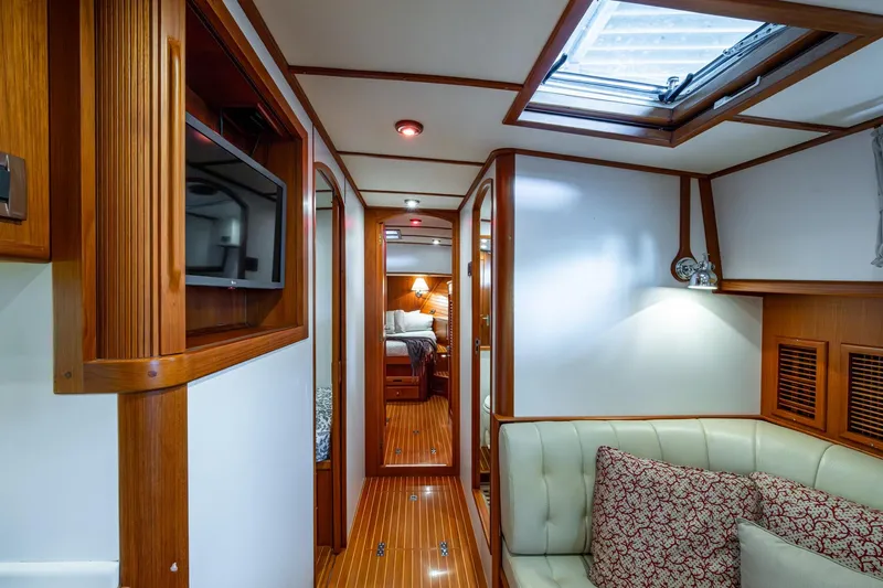 Bright Star Yacht Photos Pics Luxurious interior of 2003 Grand Banks 49 Eastbay HX yacht with wood accents and cozy seating.