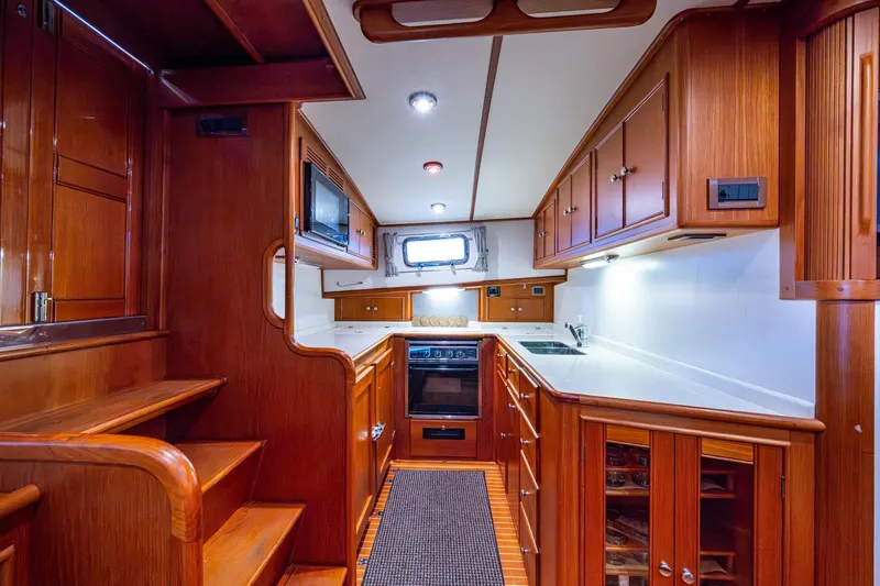 Bright Star Yacht Photos Pics Luxurious 2003 Grand Banks 49 Eastbay HX yacht interior with elegant wooden cabinetry.