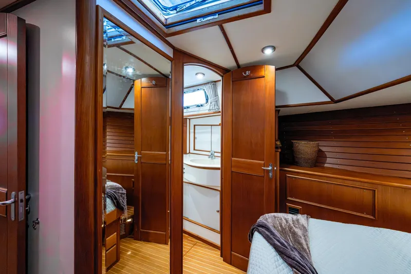 Bright Star Yacht Photos Pics Luxurious interior of 2003 Grand Banks 49 Eastbay HX yacht with wooden finishes.