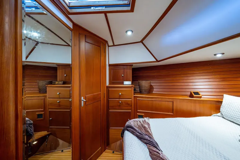 Bright Star Yacht Photos Pics Luxurious 2003 Grand Banks 49 Eastbay HX yacht cabin with elegant wood interior.