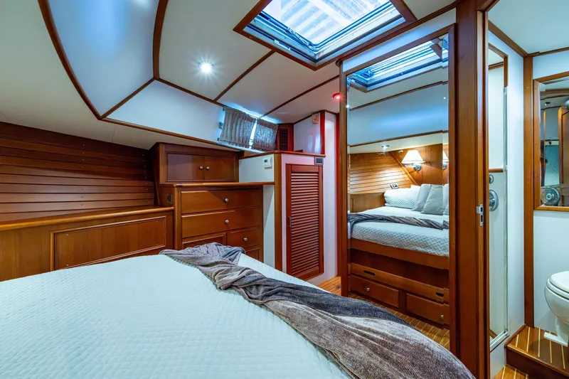 Bright Star Yacht Photos Pics Luxurious 2003 Grand Banks 49 Eastbay HX yacht cabin with elegant wood finishes.