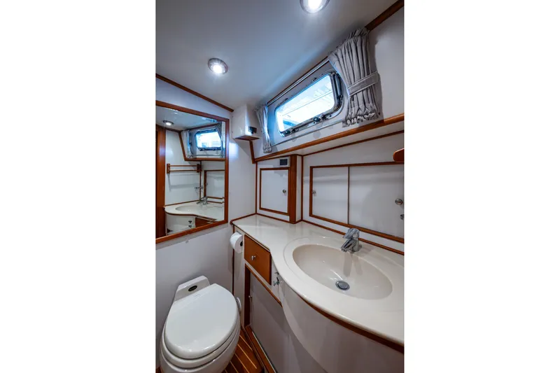 Bright Star Yacht Photos Pics Bathroom interior of 2003 Grand Banks 49 Eastbay HX yacht, featuring sink and toilet.