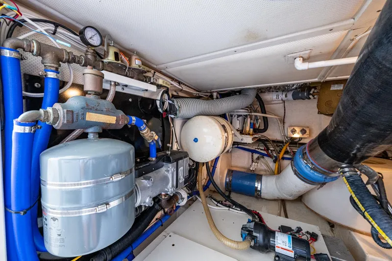 Bright Star Yacht Photos Pics Engine room of 2003 Grand Banks 49 Eastbay HX with mechanical components and piping.