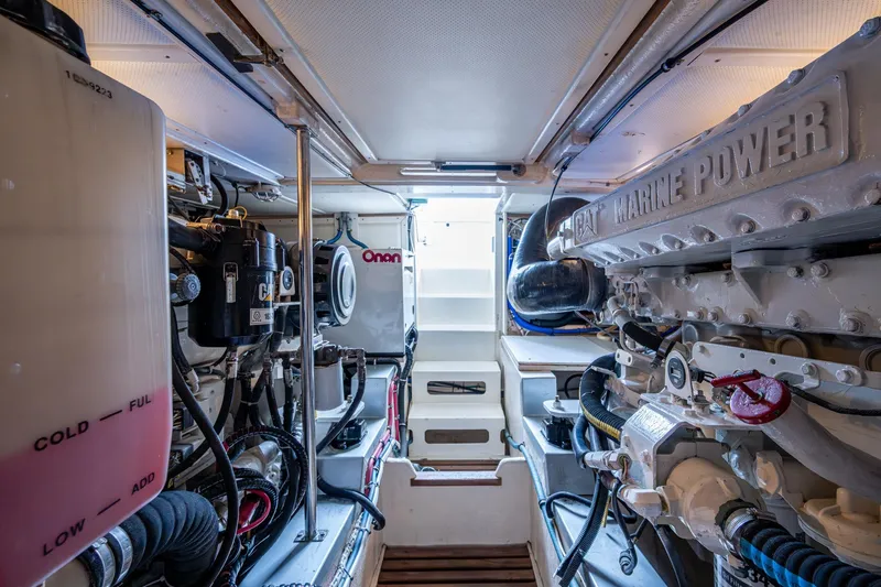 Bright Star Yacht Photos Pics Engine room of 2003 Grand Banks 49 Eastbay HX with CAT Marine Power and Onan generator.