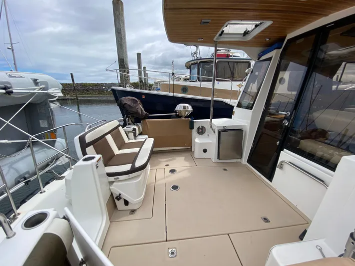 Sal-taire Yacht Photos Pics 2016 Ranger Tugs R-29S boat deck with seating and marina view.