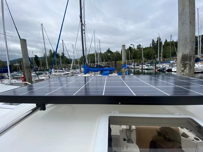 Sal-taire Yacht Photos Pics 2016 Ranger Tugs R-29S with solar panel at marina, surrounded by sailboats.