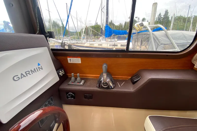 Sal-taire Yacht Photos Pics Interior helm of 2016 Ranger Tugs R-29S with Garmin navigation system and control panel.