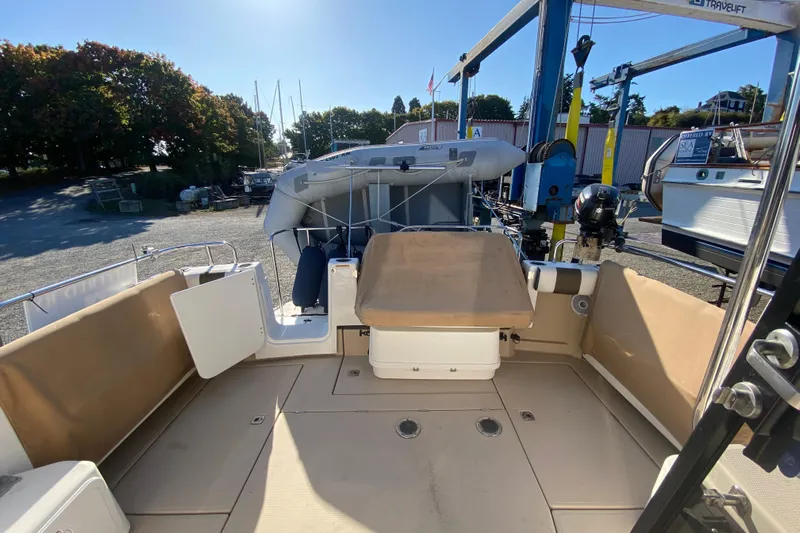 Sal-taire Yacht Photos Pics 2016 Ranger Tugs R-29S boat deck with seating and storage, docked outdoors.