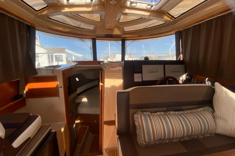 Sal-taire Yacht Photos Pics Interior of 2016 Ranger Tugs R-29S boat with cozy seating and navigation equipment.