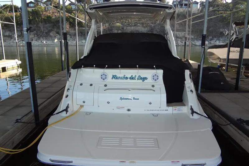 Rancho Del Lago Yacht Photos Pics 2017 Sea Ray Sundancer 350 docked, rear view with cover, in a marina setting.