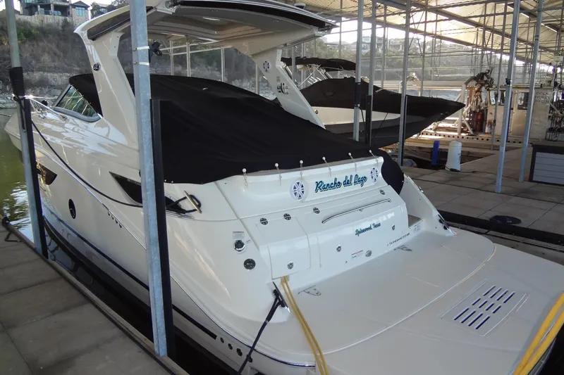 Rancho Del Lago Yacht Photos Pics 2017 Sea Ray Sundancer 350 docked in a marina, covered and ready for use.