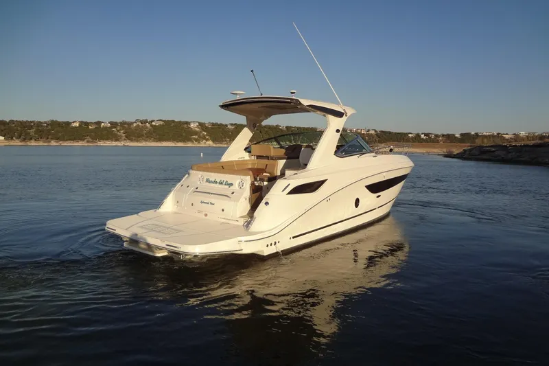 Rancho Del Lago Yacht Photos Pics 2017 Sea Ray Sundancer 350 yacht cruising on a serene lake at sunset.