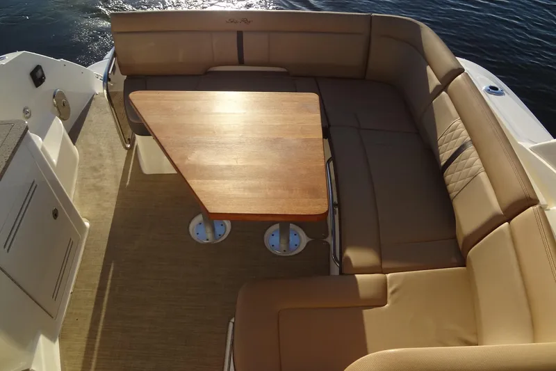 Rancho Del Lago Yacht Photos Pics 2017 Sea Ray Sundancer 350 boat interior with tan seating and wooden table.