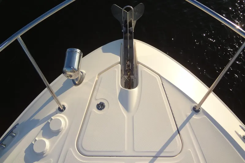 Rancho Del Lago Yacht Photos Pics Bow of 2017 Sea Ray Sundancer 350 with anchor and railing, on calm water.