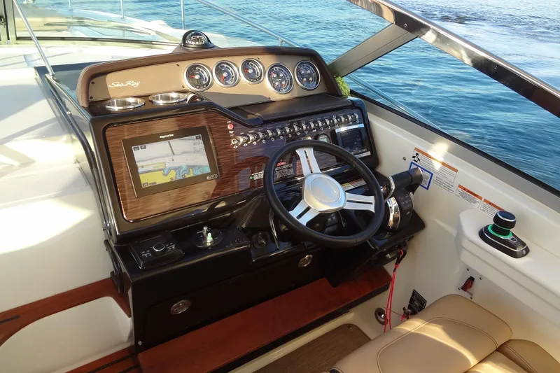 Rancho Del Lago Yacht Photos Pics 2017 Sea Ray Sundancer 350 helm with navigation system and controls, overlooking the ocean.
