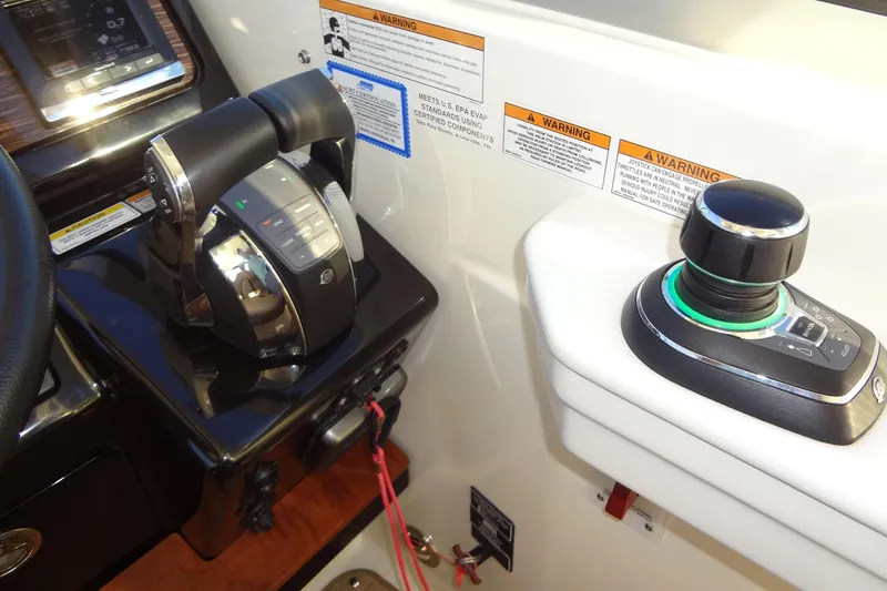 Rancho Del Lago Yacht Photos Pics Control panel of 2017 Sea Ray Sundancer 350 with throttle and joystick controls.