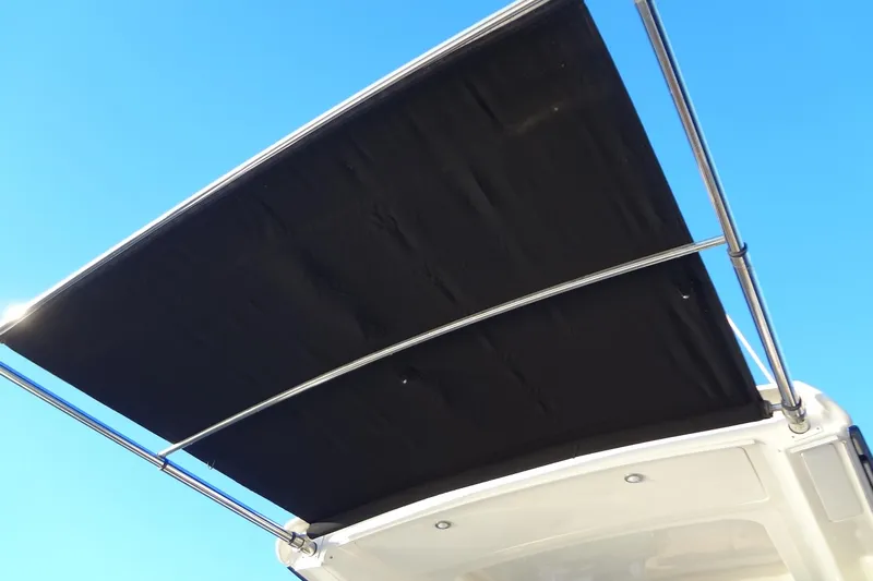 Rancho Del Lago Yacht Photos Pics 2017 Sea Ray Sundancer 350 boat canopy against clear blue sky.