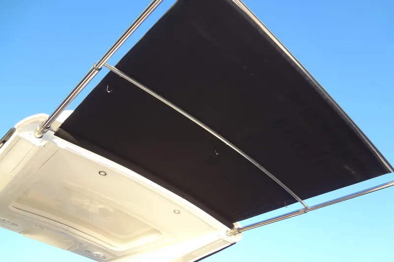 Rancho Del Lago Yacht Photos Pics 2017 Sea Ray Sundancer 350 boat canopy against clear blue sky.