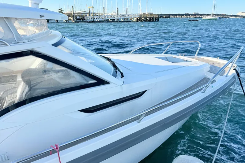 Yucca Flats Yacht Photos Pics 2023 Nimbus Weekender 9 boat docked at a marina with clear blue water.