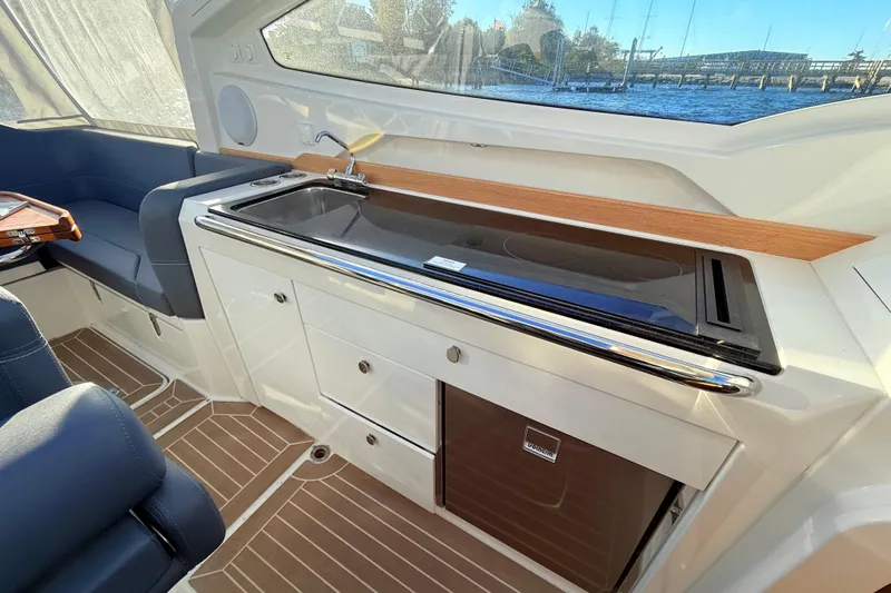 Yucca Flats Yacht Photos Pics 2023 Nimbus Weekender 9 interior with sleek kitchenette and modern seating.