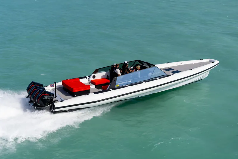  Yacht Photos Pics 2024 Goldfish 46 Open speedboat cruising on turquoise water.