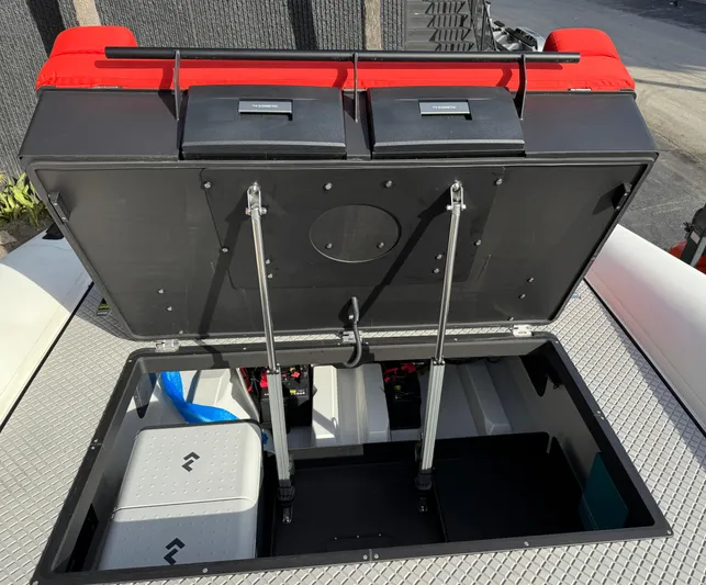  Yacht Photos Pics Open storage compartment on 2024 Goldfish 46 Open boat with red seating.