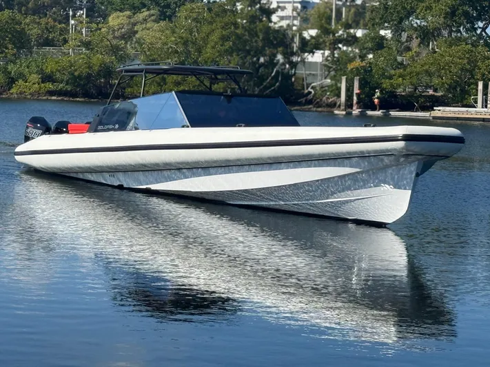  Yacht Photos Pics 2024 Goldfish 46 Open boat on calm water, sleek design, modern features.